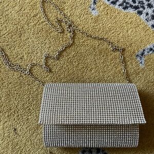 Lulu’s beaded clutch with gold chain